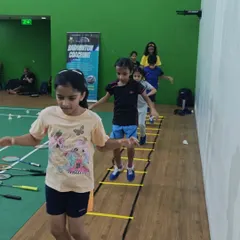 Agility is key in badminton. Here, my young students work on their footwork and coordination using agility ladders, a fun and essential part of our fitness routine for kids.