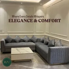 This L-shaped sectional sofa in a versatile grey fabric is designed for ultimate comfort and modern living. Paired with a marble and fluted wood coffee table, this custom seating arrangement maximizes space while offering a sophisticated look.