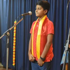 A young student stands ready to perform at our Kannada Rajyotsava celebration.