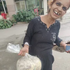 This is Veena. She works as a house help but dedicates her life to feeding stray dogs, protecting them from neighbors who throw stones. Her smile when we gave her food for her dogs is why we support local feeders.
