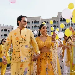 A sun-drenched Haldi in Bahrain, where the couple made a joyful entry through a tunnel of guests holding balloons. The yellow theme was carried through from outfits to decor.