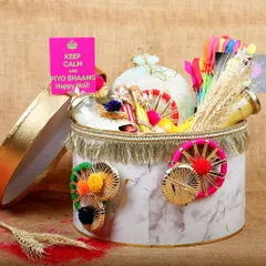 An elegant Holi gift box, showcasing a curated selection of items for a luxury gifting brand's festive collection.