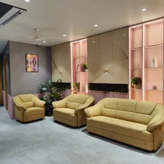 The waiting lounge at Life Care Clinic, designed to make the experience pleasant and comfortable. We used soft, upholstered seating and a feature wall with integrated shelving and subtle lighting to create a space that feels more like a luxury lounge than a clinic.