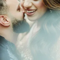An extreme close-up capturing a moment of whispered secrets and laughter, focusing on the bride's joyful smile.