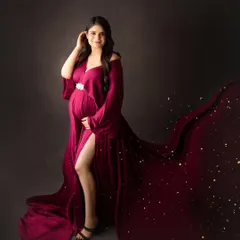 A touch of magic with sparkling lights accenting the flowing train of this beautiful magenta gown.