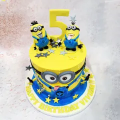 Our 3D Minions Cake brings the mischief to life with two expressive minions on top and a large minion face wrapping around the cake itself.