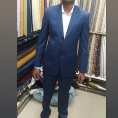 Here is a client trying on his new two piece suit right here in my Gurgaon shop. I personally ensure the fit is perfect across the shoulders and the drape of the trousers is just right, so you leave feeling confident in your new bespoke attire.