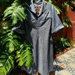 A versatile denim-look dress that can be styled in so many ways. The relaxed fit and classic collar make it a perfect canvas for a statement necklace, like the red dragon piece shown here.