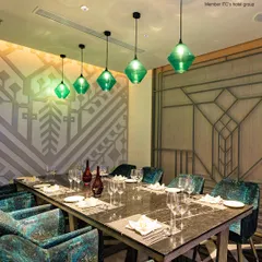 The elegant design of my Private Dining Room is highlighted by contemporary green glass pendant lights and luxurious seating. It is the ideal space for hosting a private dinner party or celebrating a special occasion with close family and friends.