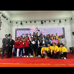 The entire team celebrating a major victory on stage. Moments like these are built on a foundation of shared goals, mutual support, and relentless training.