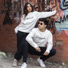 Another dynamic pose from the same series, this shot adds movement and interaction between the models. It creates a story and shows the clothing in a more active, lifestyle context.