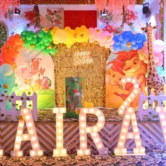 We bring the jungle to your party with our vibrant and detailed safari themes. This setup includes a stunning gold shimmer wall, custom character cutouts from The Lion King, large marquee letters, and a colorful balloon arch, creating an immersive experience for your child's celebration.
