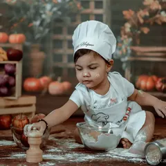 Adding a pinch of seasoning. The details in these themed shoots, from the wooden salt shaker to the fresh produce in the background, create a rich and believable scene.