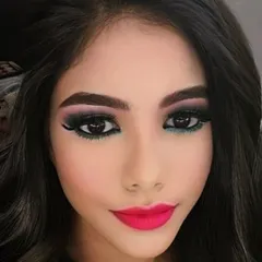 A close up on a bold party look. I created this dramatic eye with a sharp wing and blended liner, paired with a vibrant fuchsia lip to show my skill in creating sharp, impactful makeup that is perfect for evening events.