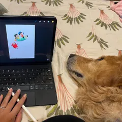 A closer view of a digital illustration in progress. You can see my hand and stylus, showing the hands-on nature of digital drawing. My dog always seems to be my most dedicated observer.