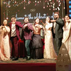 The family that dances together, stays together. Getting the whole family on stage for a fun segment during a 25th-anniversary celebration.