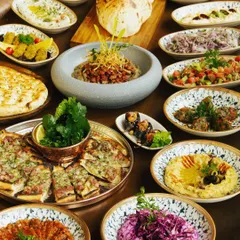 We offer an extensive menu of Turkish and Mediterranean delights. This grand spread showcases the variety we offer, from flavorful mezzes and salads to freshly baked breads and pizzas.