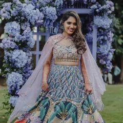 A beautiful shot of the bride by the purple phone booth, a whimsical and romantic installation.
