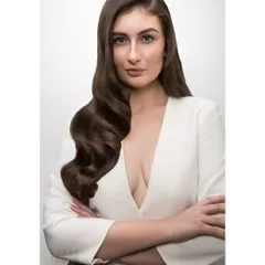 This portrait for a hair beauty campaign showcases a powerful, confident look. My retouching process ensures that while the image is commercially polished, the model's expression and skin texture remain authentic and strong.