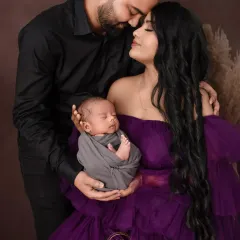 An intimate close-up of a new family. I focus on capturing the emotional connection between parents and their newborn in these first precious days.