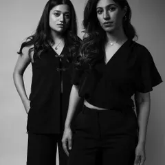 A powerful portrait of two friends, Amira and Anahita. Their strong, united stance in this black and white photo speaks volumes about their connection and shared journey.