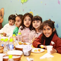 A group of young students enjoying their snacks together. Our venue is perfect for organized and supervised group events.