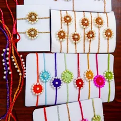 A closer look at my handmade crochet rakhi and lumba sets, featuring intricate pearl work. These are perfect for celebrating the bond between brother and sister-in-law.
