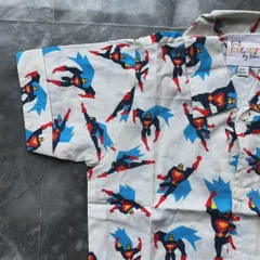 Here is a close-up of the vibrant Superman print on our popular boys' pajama set. You can see the quality of the 100% cotton fabric, which stays soft and bright even after many washes.