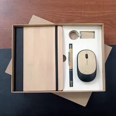 Another look at my popular eco-friendly welcome kit. This set features a bamboo-covered notebook, a matching pen and keychain, and a wireless mouse, perfect for companies looking to make a green statement.
