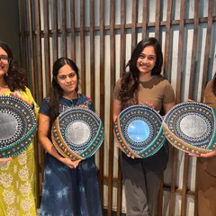Four participants showcasing their stunning, unique mandala mirrors. Each piece reflects the artist's personal style and color choices, making it a truly special creation.