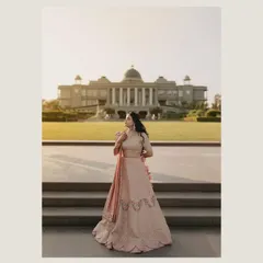 A breathtaking bridal portrait at Raffles Udaipur. The grandeur of the palace provides a majestic backdrop, highlighting the bride's elegance and the timeless beauty of the setting for her Mehendi.