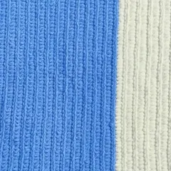 A flat lay of the blue and white striped baby blanket, showing the neat, ribbed stitch pattern.