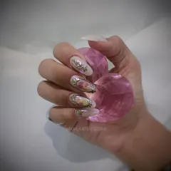 A different angle of the vintage floral nails, showing the delicate painting and sculpted frame.
