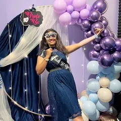 A fun, playful shot of the bride-to-be with her themed glasses and sash. It’s all about creating happy, Instagrammable moments for her special day.