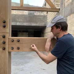 A site photo from the House of Galleries, showing our team on the timber mockup. This hands-on process of testing and refining details on site is crucial to the success of our projects.