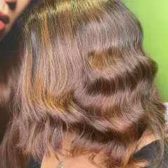 A side view of the caramel highlights, showing how the color beautifully frames the face.