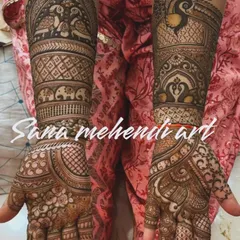 This design showcases a variety of traditional elements, with peacocks and elephants drawn in bands along the arm. The mix of figures and patterns gives a classic and festive feel.