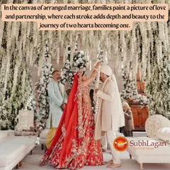 A bride places the garland on her groom during a beautiful Varmala ceremony under a canopy of white flowers. This moment signifies mutual acceptance and the start of their journey as partners.