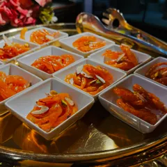 Freshly made Jodhpur Jalebis, served hot in individual portions. These crispy, syrup-soaked swirls are a crowd favorite, and their preparation at a live counter is always a treat to watch.