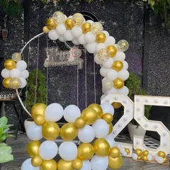 An elegant and classic 25th anniversary decoration. I used a white and gold balloon arch on a circular frame, a hanging 'Happy Anniversary' sign, and large marquee light-up numbers for the '25'.