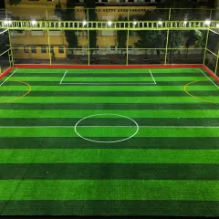 The JP Nagar turf lit up for evening games. We ensure our facilities are well-lit and safe for you to play after the sun goes down.