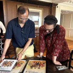 A candid moment with Aamir Khan ji as I show him the details in a calendar featuring his iconic film roles. His keen eye and appreciation for the finer points of art are remarkable.