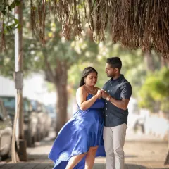 A romantic moment on a city sidewalk, with the wind catching her dress perfectly. I love using the urban environment to create beautiful, candid-style pre-wedding photos.
