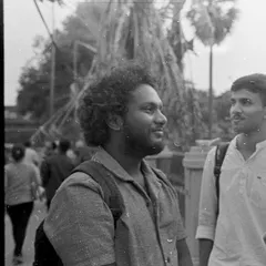 A candid street photograph taken on black and white film. This image shows the beautiful tones and classic feel that make film photography so enduringly popular.