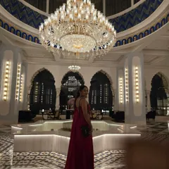 Posing under a magnificent chandelier at the Fairmont hotel in Udaipur. This city's royal charm makes it one of my favorite places to host weddings.