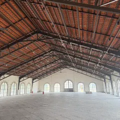 We have experience with large commercial and industrial spaces. This photo shows a massive warehouse-style building we painted, ensuring a clean and professional finish across a very large surface area.
