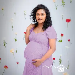 For a softer, more classic look, this beautiful purple lace gown is an excellent option from our wardrobe. It drapes elegantly over the baby bump and is incredibly comfortable to wear during your session.
