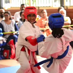 Two of our young female karatekas engaged in a focused sparring match during a national level tournament. Their intensity and technique showcase the competitive spirit we nurture at the academy.
