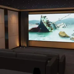 Experience movies on a grand scale with a wall-to-wall fixed screen and a professionally installed 4K projector. Here, we opted for a comfortable, expansive lounge sofa, perfect for casual family movie nights.