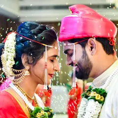The sacred Akshata ceremony, a pivotal moment in a Marathi wedding. We capture the emotion as the couple showers each other with blessed rice, symbolizing prosperity and happiness.